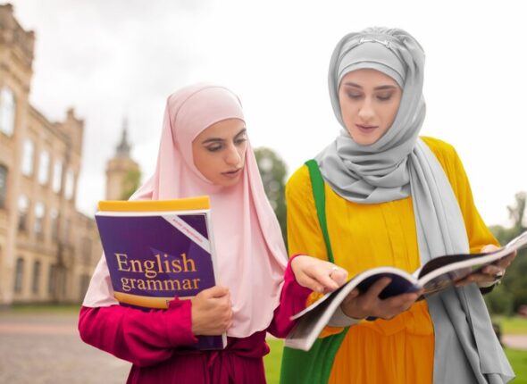 students-repeating-english-busy-international-muslim-students-repeating-english-while-walking-class_259150-48368